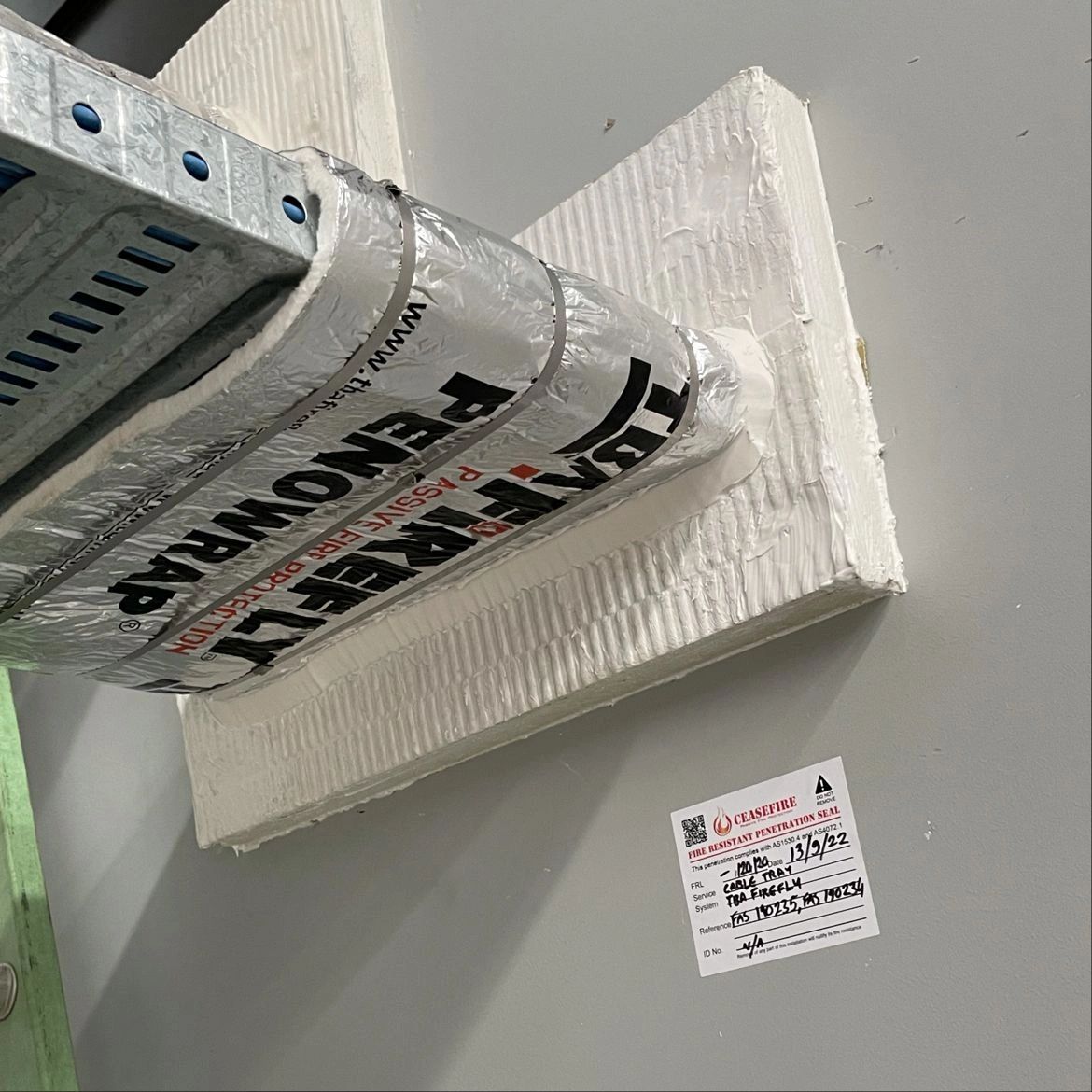 Fire seal of cable tray penetrating masonry wall Fire seal of cable tray penetrating masonry wall