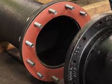 Close-up of two flanged pipe ends with bolt holes.