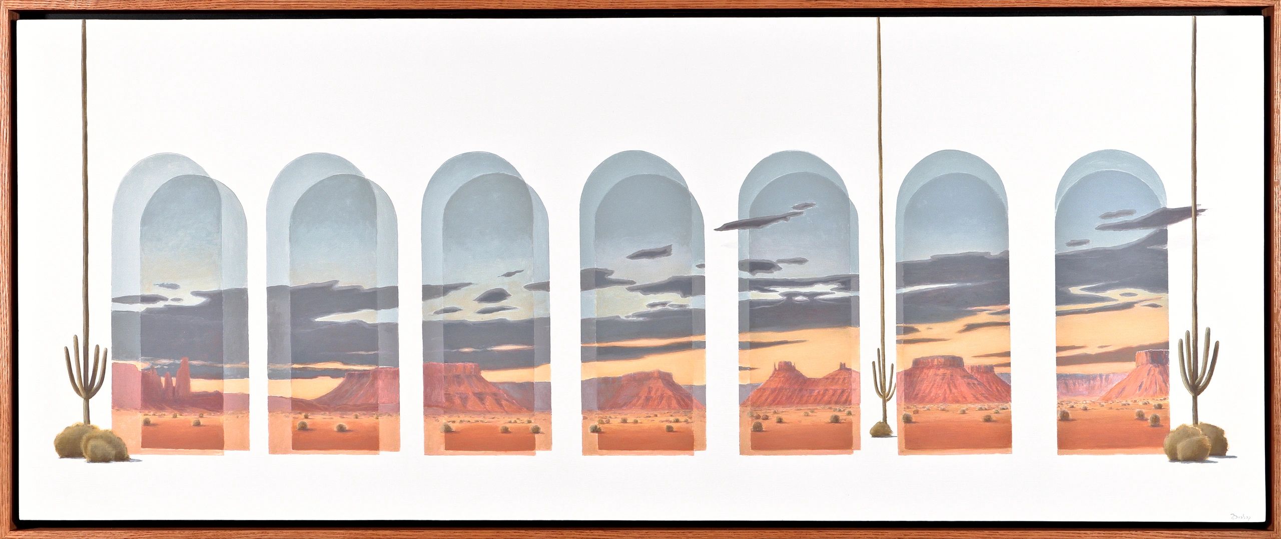 desert buttes with clouds and tall saguaros