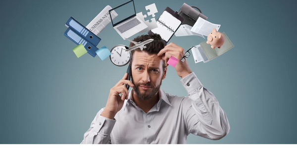 Stressed man juggling work tasks and time management challenges.