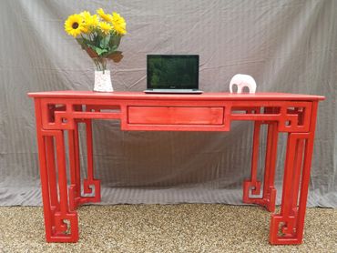 custom desk with Greek key accents in bright red