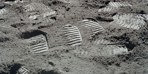 Foot steps by Apollo astronauts on the Moon, prepared for an unknown World.