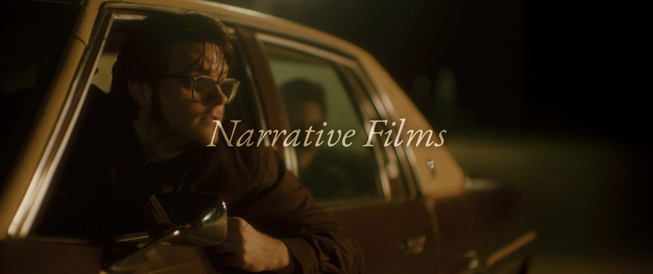 Man leaning out of a car window at night with 'Narrative Films' text.