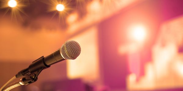 microphone on a lecturn on stage ready for a meeting or a presentation.