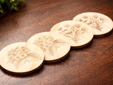 Wooden coasters with floral engravings.