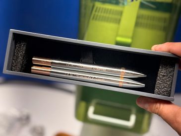 Three pens in a box, labeled Qualcomm Innovation.