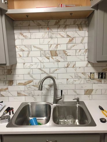 New faucet and backsplash installation 