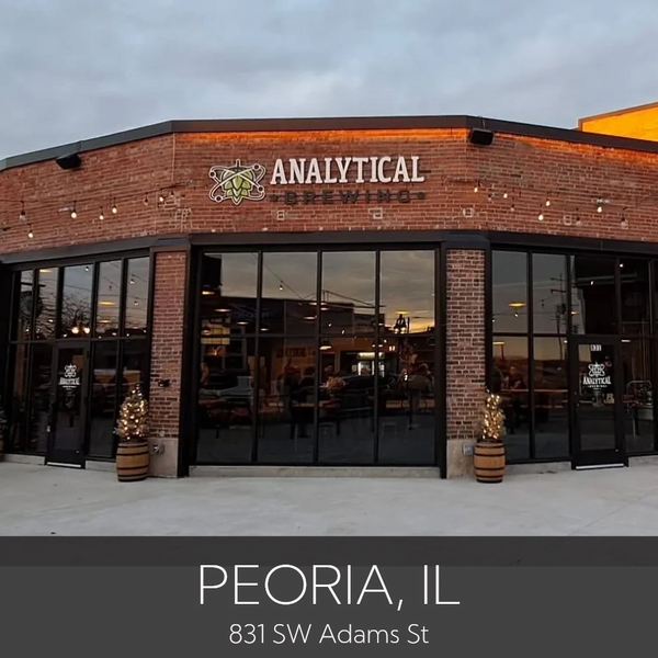 Outdoor seating area of Analytical Brewing in Peoria, IL, with string lights overhead.