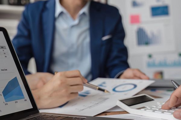 A woman with man Working each other with disgust graph on the paper