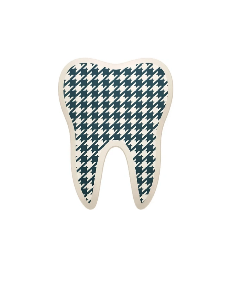 Tooth-shaped object with black and white houndstooth pattern.