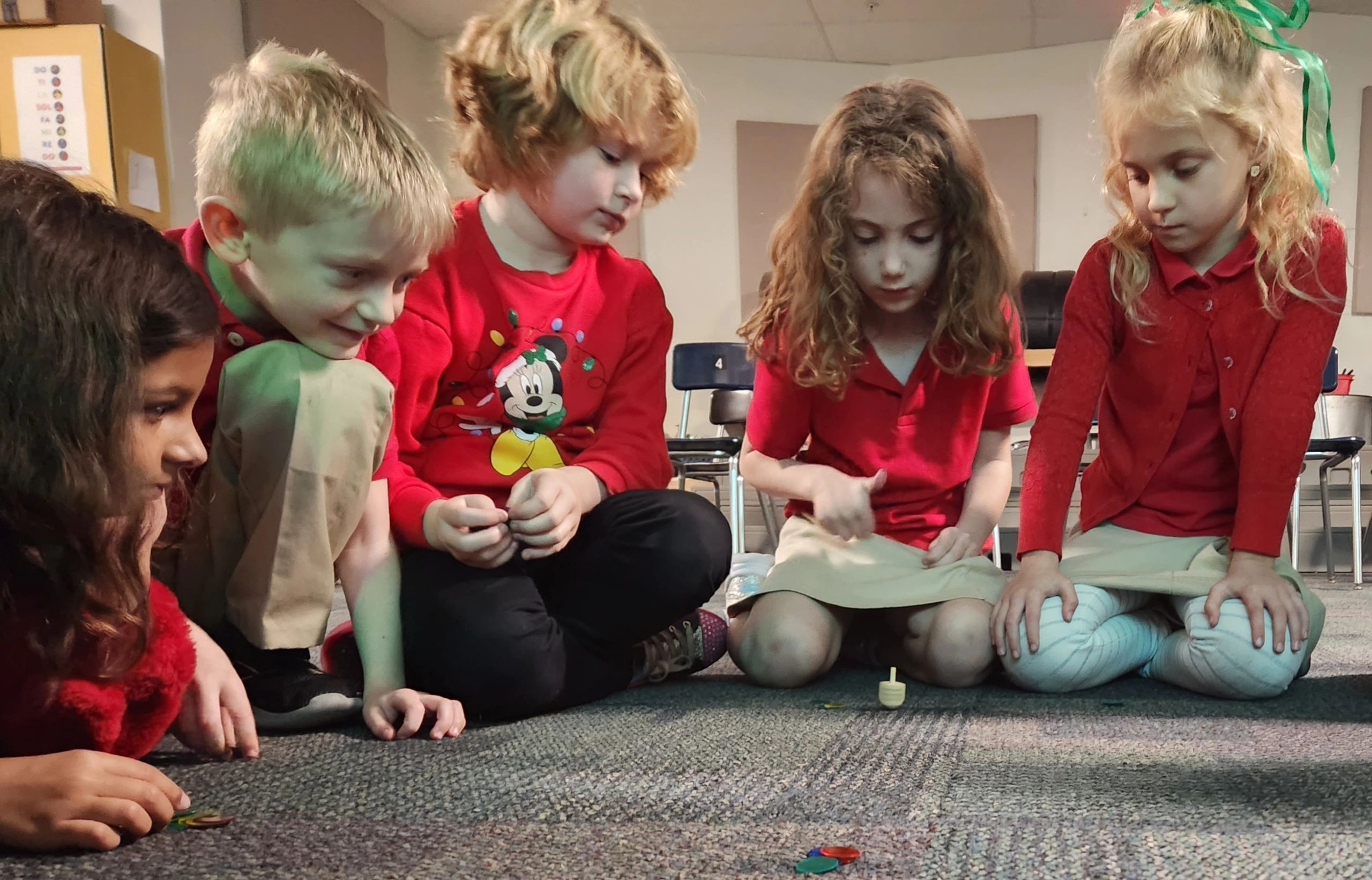 1st Grade students learned Dreidel Dreidel & then learned how to play the game it is named for.