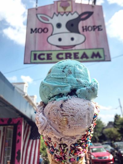 Cookie monster ice cream and blueberry crumb cake ice cream in a fresh chocolate waffle cone