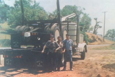Conrad Will Sr., Steve Will and Connie Will Jr. at the truck shop in 1984