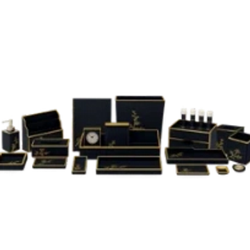 Luxurious black and gold desk organizer set with multiple compartments and accessories.