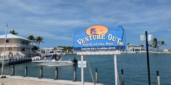 Sign for Venture Out fishing charter at Cudjoe Key, Florida Keys.