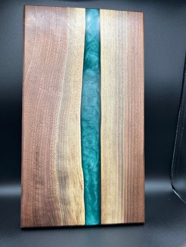 Black walnut epoxy resin river board with teal pigment