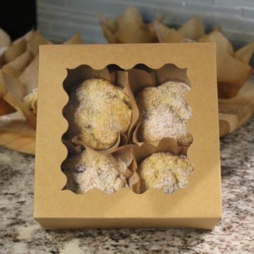 Box of four muffins.
