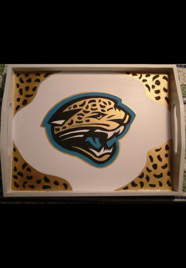 Wooden tray featuring a stylized jaguar logo with leopard spots and teal accents.