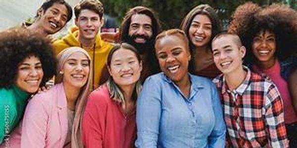 Diverse group of friends smiling together outdoors.