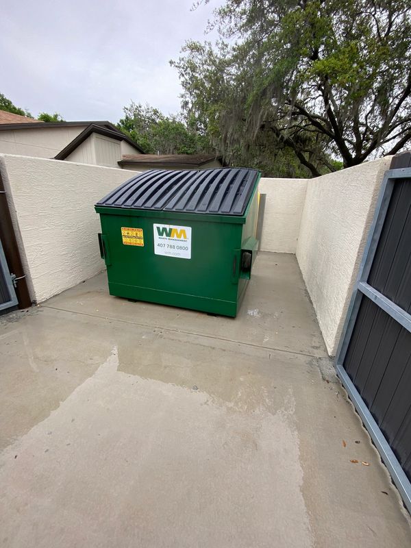 Dumpster pad cleaning in Volusia County, FL. Eliminate grease, odors, and bacteria.