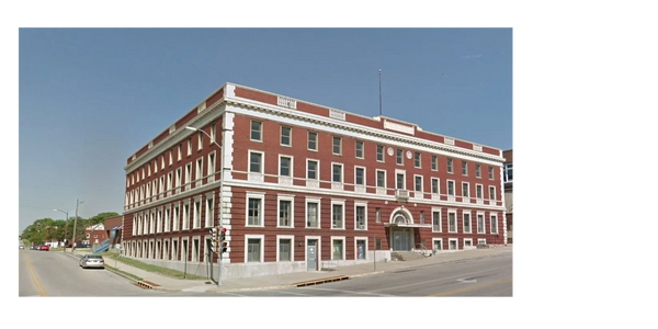 Y Loft senior apartments in Kansas City Kansas front exterior photo.  Brick building with white trim