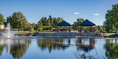 Photo of  a park lake and pavilion shelters