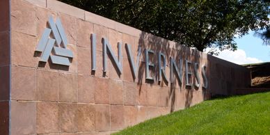 Picture of an Inverness Business Park sign brick  landscape wall that says "Inverness"