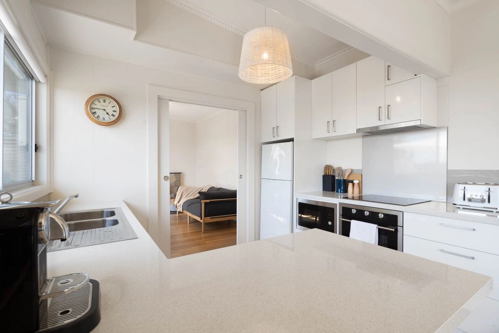 A clean, white kitchen.