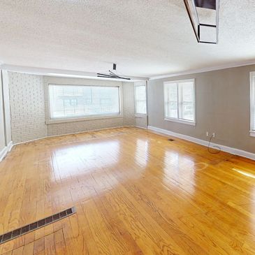 Kansas City West Plaza Apartment with hardwood floors and natural light from abundant windows.