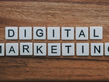 Tiles on wood spelling out DIGITAL MARKETING.