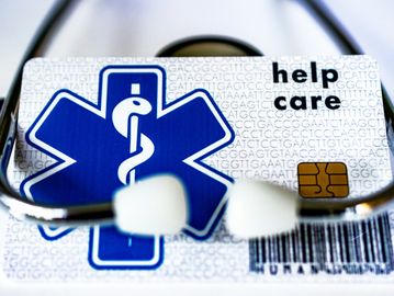 Medical insurance card with a stethoscope, symbolizing healthcare coverage.