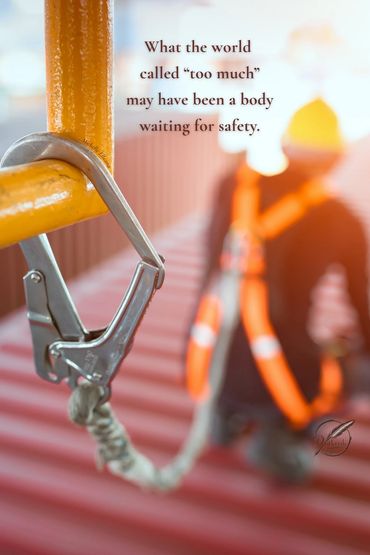 Safety worker, carabiner blurred—quote; What the world calls too much was a body waiting for safety