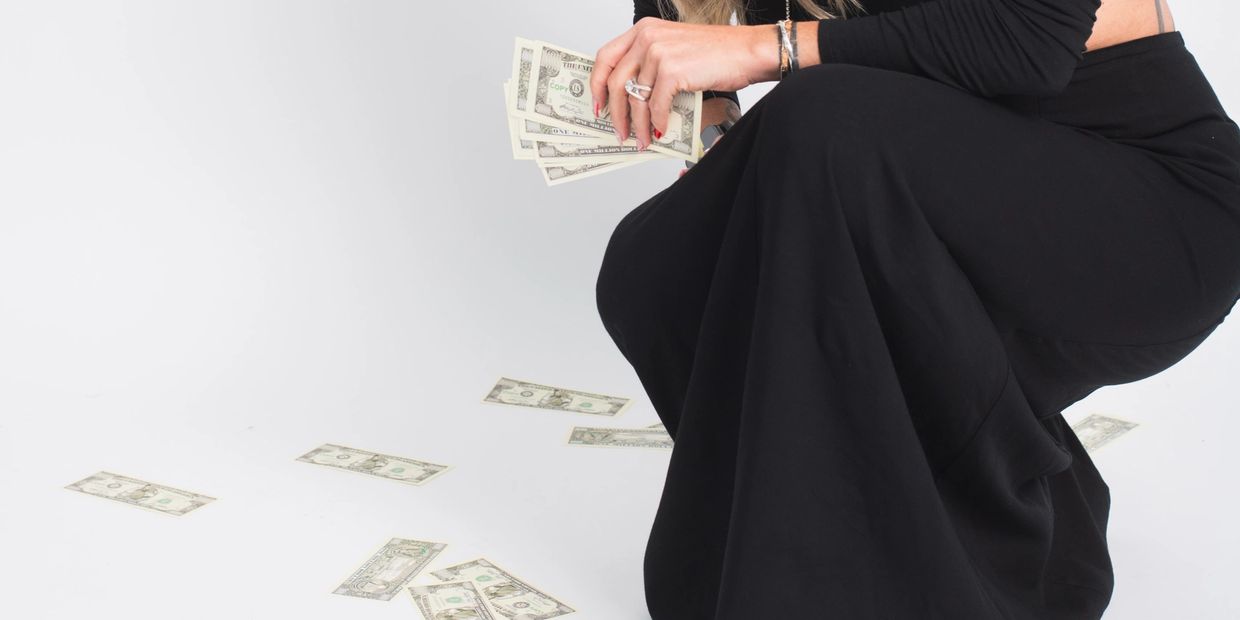 Mandy at The Spa at Salon M holding money 