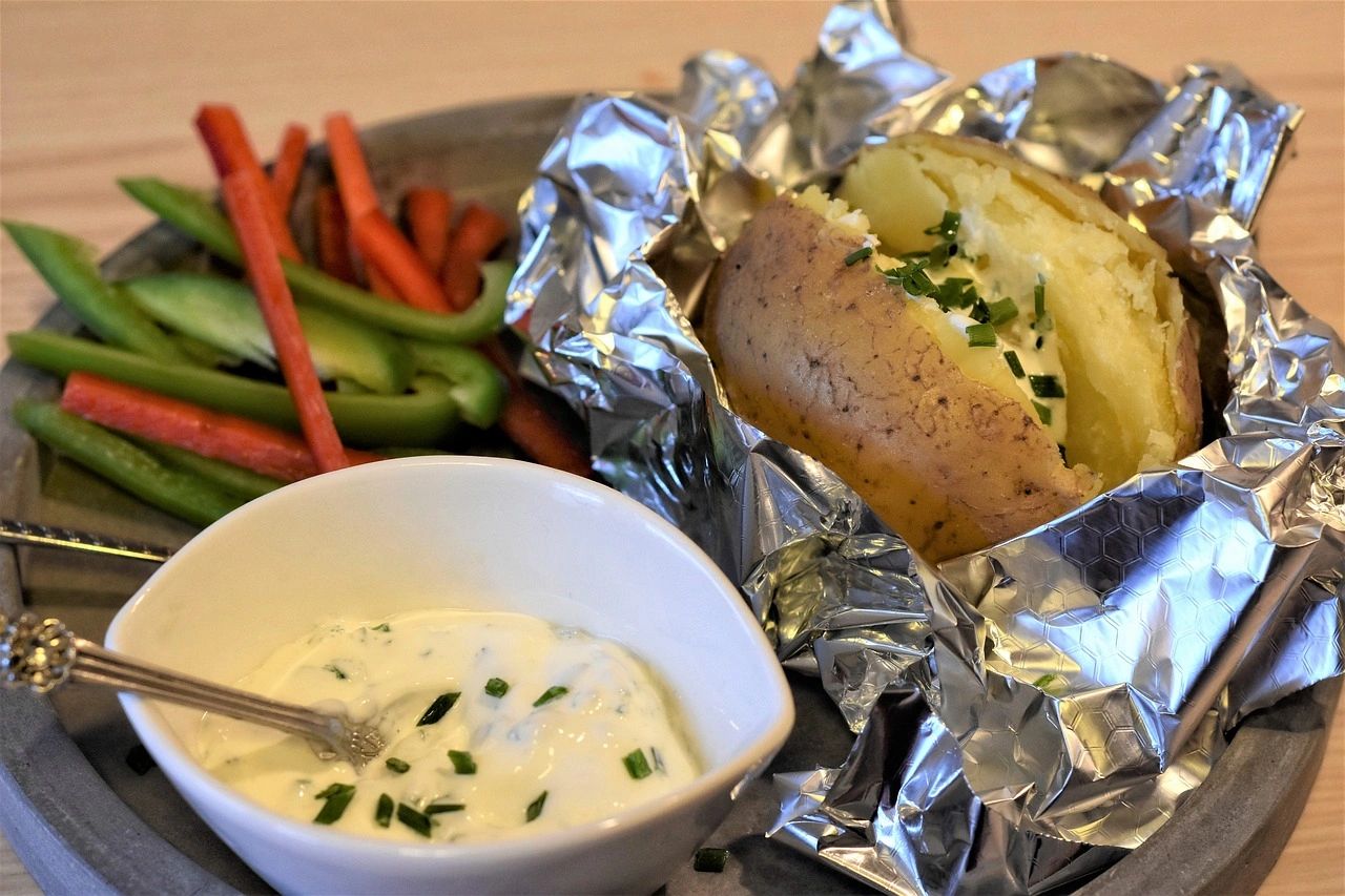 Potato baked in foil with a side of green and red peppers, and whipped cottage cheese Potato baked in foil with a side of green and red peppers, and whipped cottage cheese