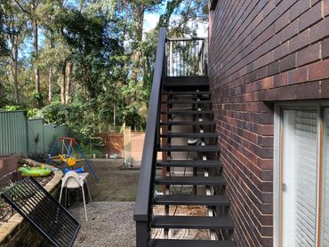 Black elegant stairs painting at Brisbane, Queensland, also leaving it a flawless finish.