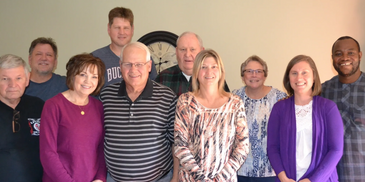 This is a picture of Austin and Amanda with the TTL board members. 