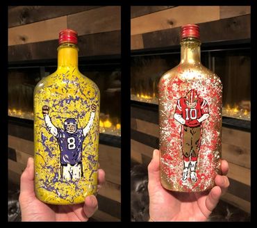 Two decorated bottles with football player designs.