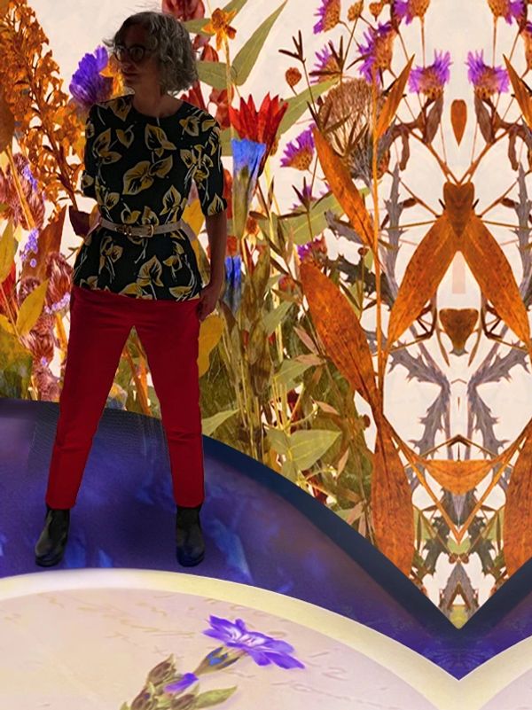 woman in an immersive room with colorful 
projections and animation by Robin Vuchnich & XO Immersive