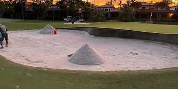 New Bunker Sand mounds in a golf course bunker.