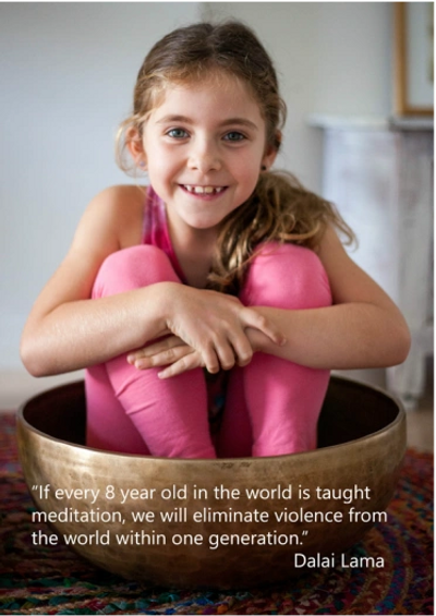 child sitting in singing bowl