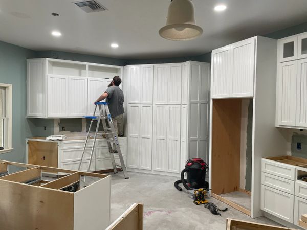 Custom cabinets on angled wall, cabinet install,  beaded cabinet doors, white kitchen 