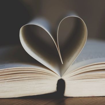 Pages of a book folded into a heart shape.