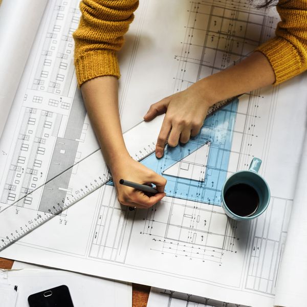 An architect working on architectural plans