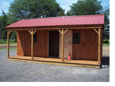 8' X 20' + 4' porch. Stained board & bat, red metal roof. 1 dbl, 1 man door, 4 windows.