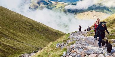 Women hiking to the top of a mountain