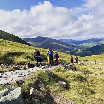 Group of women hiking up a mountain in the UK, Ben Nevis 