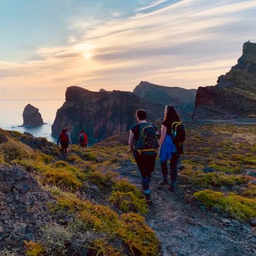 Group of women hiking on the coast of Madeira with the sunrise