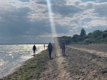 Women hiking on the beach