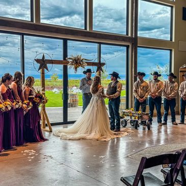 Wedding ceremony n front of big picture windows.