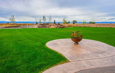 Outdoor wedding space in western Colorado with green grass, fire pit and beautiful views. 